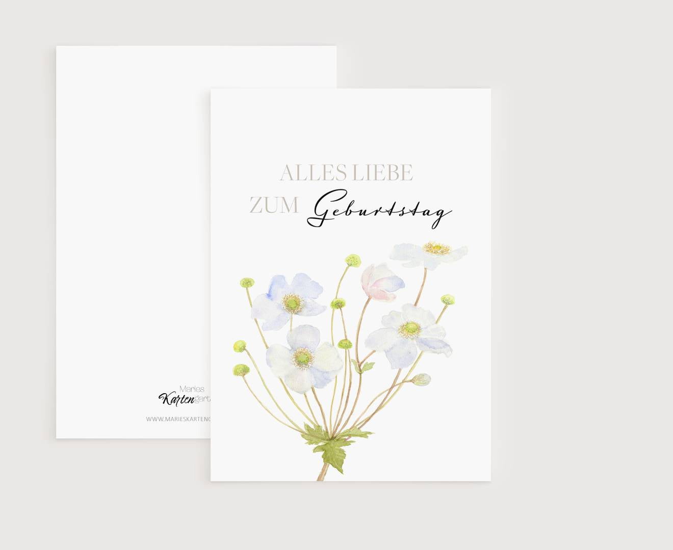 a greeting card with watercolor flowers on it