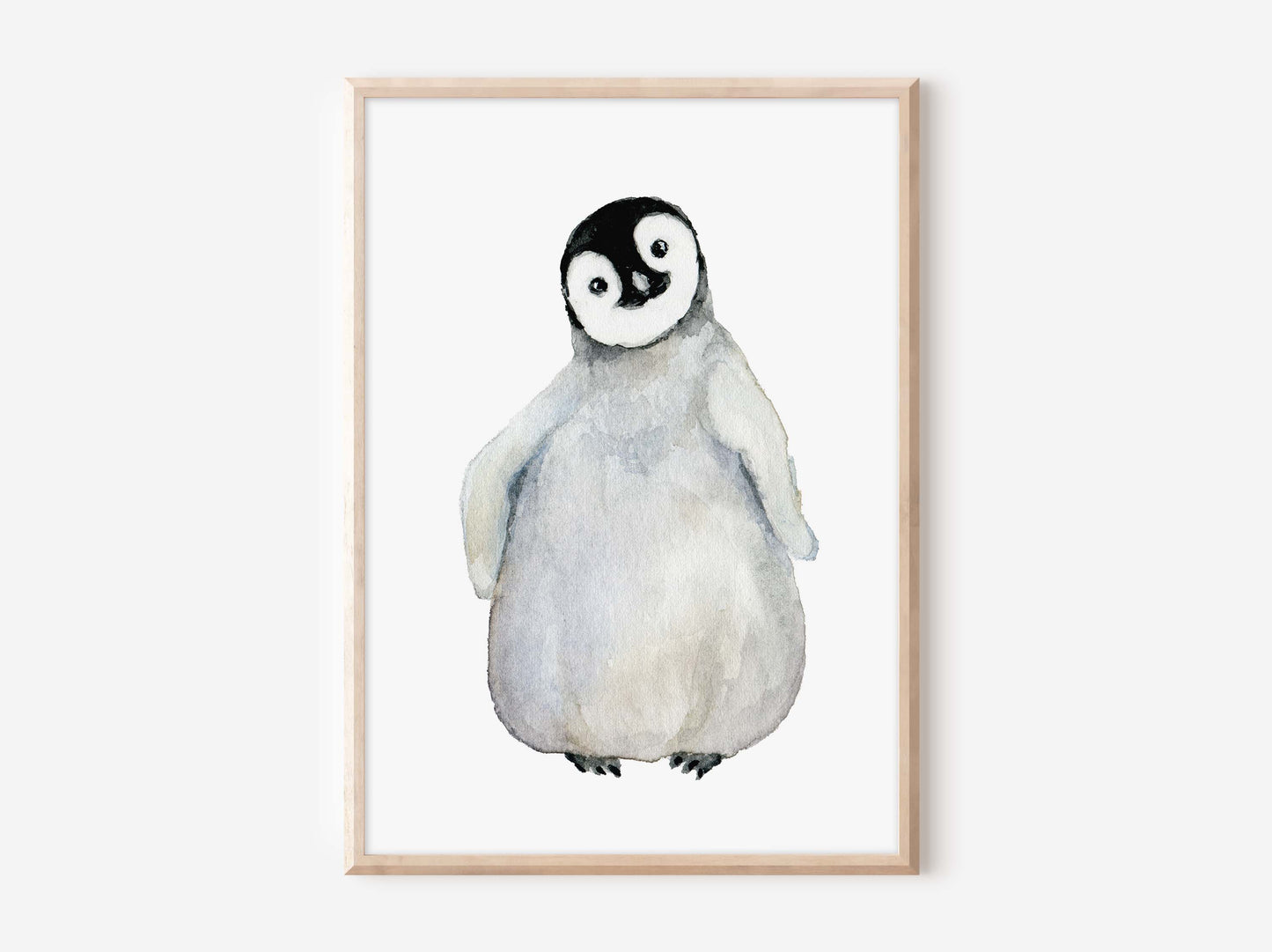 a white and black penguin with a black spot on its face