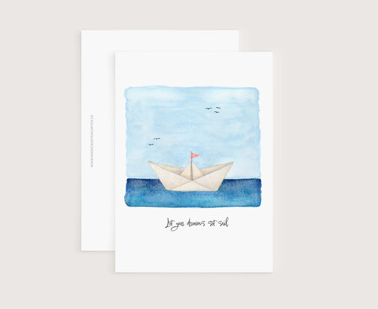 a card with a paper boat floating on the water