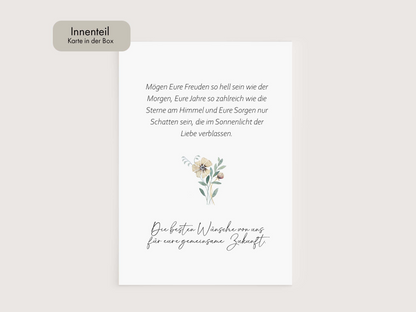 a white card with a flower on it