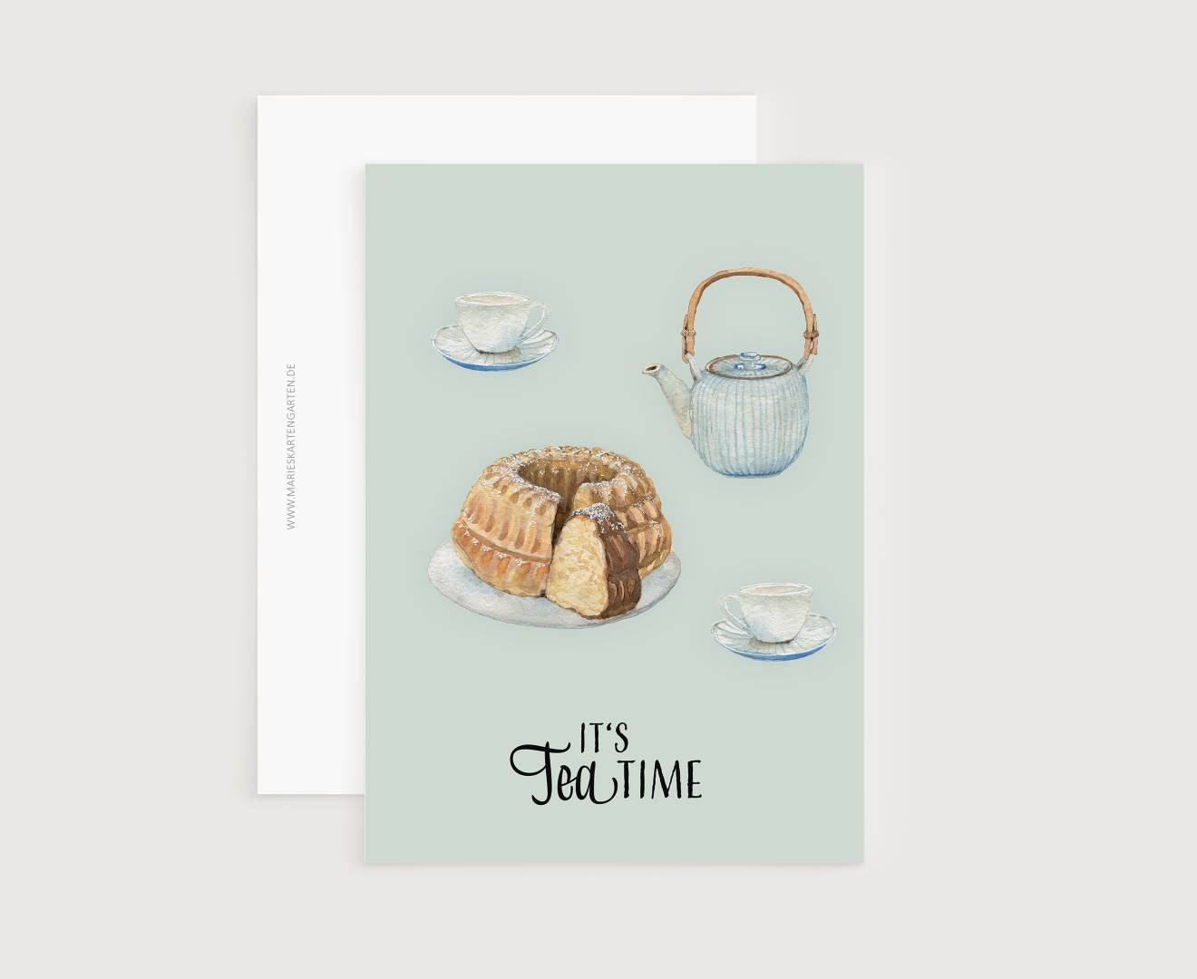 a card with a picture of a cake and a teapot