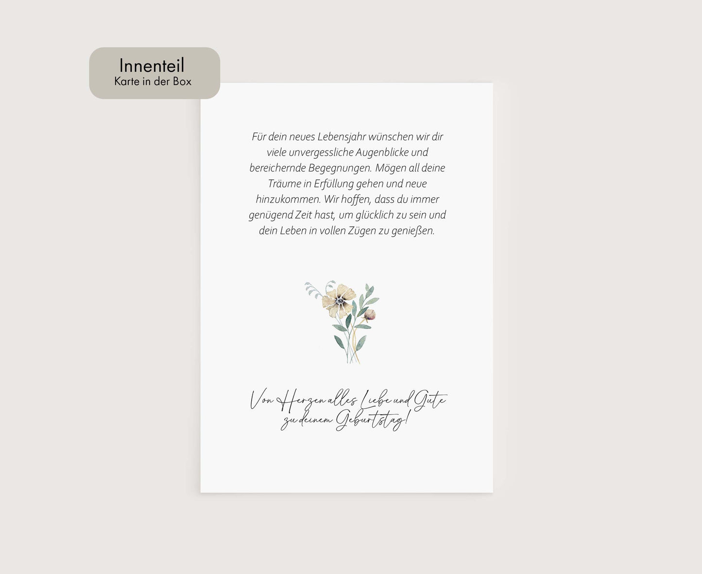 a white card with a flower on it