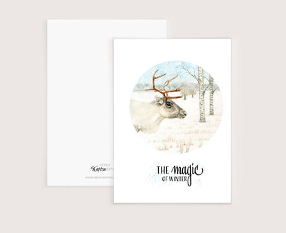 a card with a picture of a deer in a snowy forest