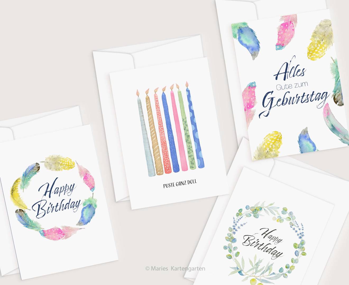 four birthday cards with watercolor feathers on them
