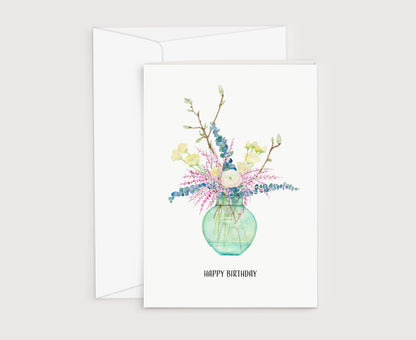 a card with a vase of flowers on it