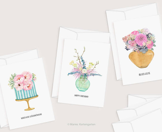 a set of four cards with flowers in vases