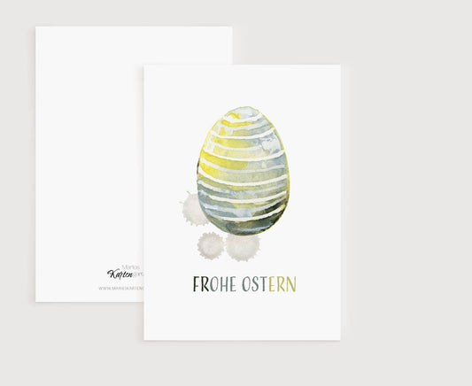 a card with a watercolor painting of an egg
