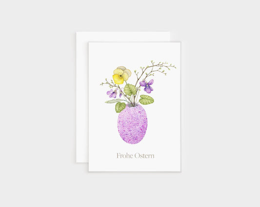 a card with a purple vase filled with flowers