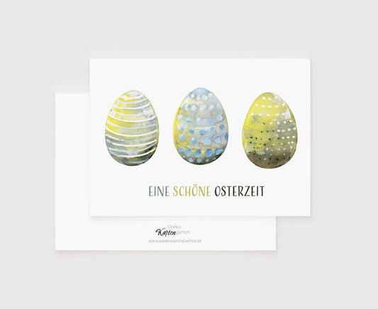 a card with three painted eggs on it