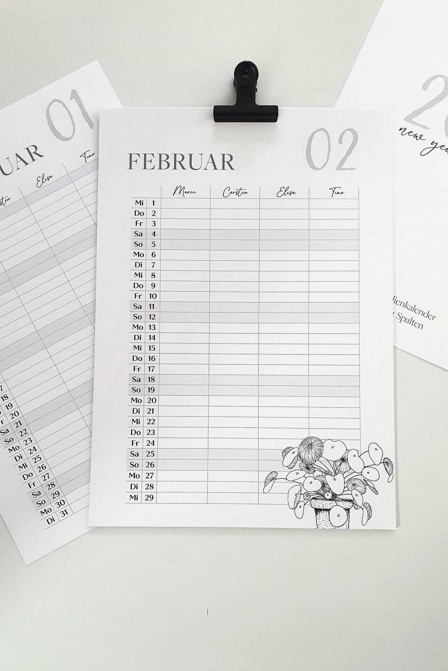 a clipboard with a calendar attached to it